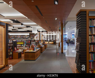 Elevation with aisles, till and entrance. Kinokuniya EmQuartier Bangkok, Bangkok, Thailand. Architect: Kay Ngee Tan Architects, Stock Photo