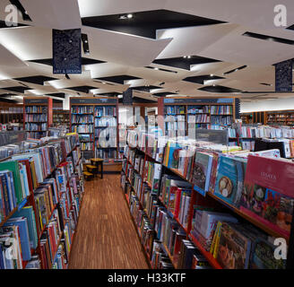 Folded ceiling feature and book display. Kinokuniya EmQuartier Bangkok, Bangkok, Thailand. Architect: Kay Ngee Tan Architects, 2016. Stock Photo