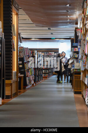 Perspective and book display. Kinokuniya EmQuartier Bangkok, Bangkok, Thailand. Architect: Kay Ngee Tan Architects, 2016. Stock Photo