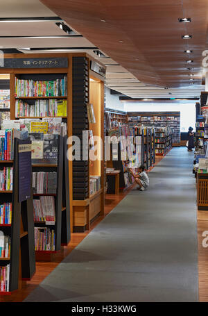 Perspective and book display. Kinokuniya EmQuartier Bangkok, Bangkok, Thailand. Architect: Kay Ngee Tan Architects, 2016. Stock Photo