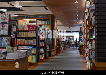 Perspective and book display. Kinokuniya EmQuartier Bangkok, Bangkok, Thailand. Architect: Kay Ngee Tan Architects, 2016. Stock Photo