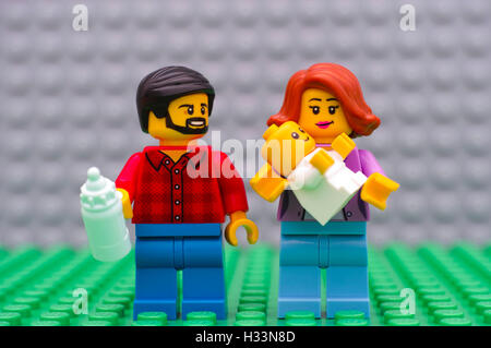 Tambov, Russian Federation - September 21, 2016 Lego family minifigures - father, mother and baby. Studio shot. Stock Photo