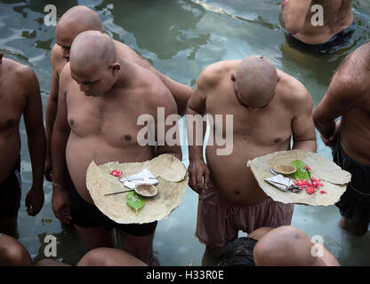 The image of men praying to ancestors banganga walkeshwar mumbai maharashtra india Stock Photo