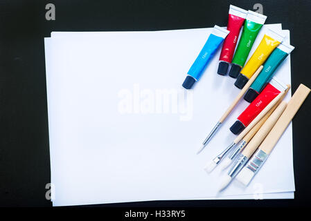 school supplies on the table, color paint and pencils Stock Photo