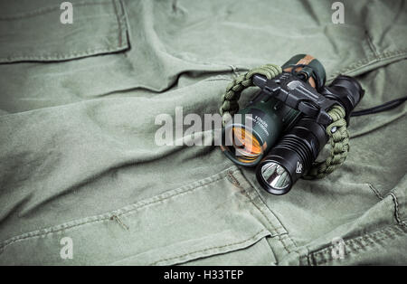 Military paracord bracelet, tactical torch and spy-glass Stock Photo