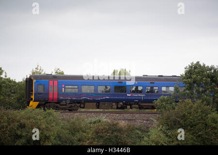 A First Great Western (FGW) commuter train on a railway line. Stock Photo