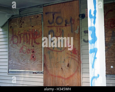 Gang graffiti and markings on an abandoned house, Detroit, Michigan, USA Stock Photo