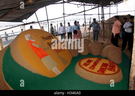 Sand sculpture artist Sudarsan Pattnaik makes sand message on the eve Indian Prime Minister Narendra Modi's birthday Mumbai Stock Photo