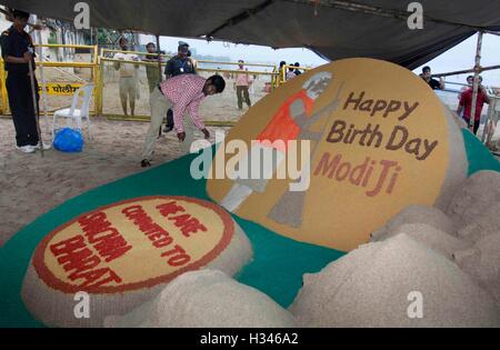 Sand sculpture artist Sudarsan Pattnaik makes sand message the eve of Indian Prime Minister Narendra Modi's birthday Mumbai Stock Photo