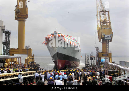 Mormugao stealth destroyer rolls into sea during its launch in Mumbai, India on September 17, 2016. Built Stock Photo