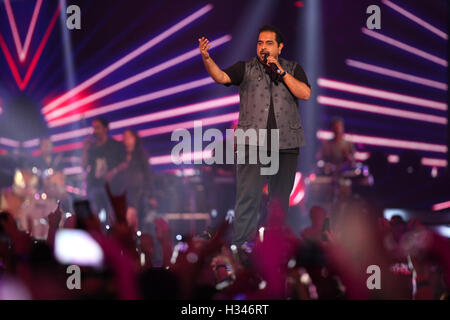 Bollywood singer Shankar Mahadevan singing during the live concert and music launch of the movie Rock On 2 in Mumbai India Asia Stock Photo