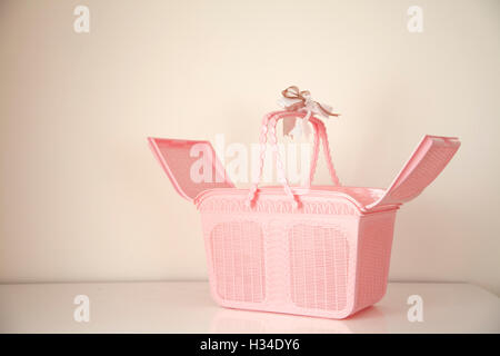Open Pink basket with copy space on background Stock Photo