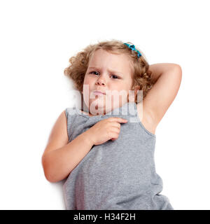 Young little girl lying over isolated white background Stock Photo