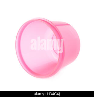 Pink plastic beaker cup isolated over the white background Stock Photo