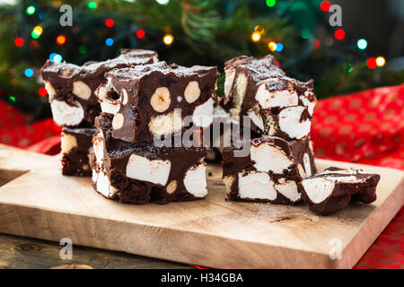 Rocky road crunch bars, christmas dessert made with chocolate,  marshmallow, hazelnut, biscuit and glace cherries Stock Photo