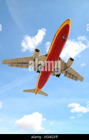 DHL Aircraft approaching London Heathrow airport. Stock Photo