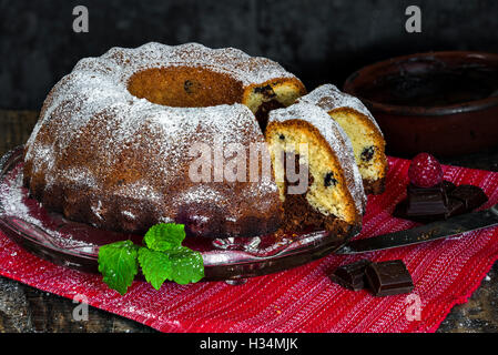 Home baked marble cake on rustic wooded table Stock Photo