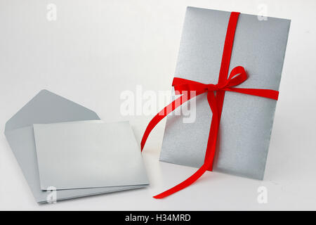 Grey envelope with blank grey card Stock Photo