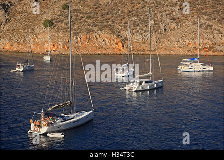 Yachts anchored at Mandraki beach, Hydra island, Attica, Greece. Stock Photo