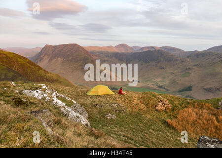 Wild camper on High Snockrigg, Robinson, above Buttermere in the English Lake District national park Stock Photo