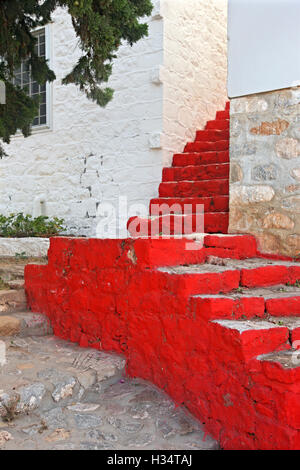 Impressive red staircase at Kamini (or 'Kaminia') village, Hydra island, Attica, Greece. Stock Photo