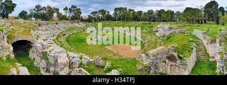 Anfiteatro Romano (Roman Amphitheatre) at the  Parco Archeologico della Neapolis, Syracuse, Sicily, Italy. Stock Photo