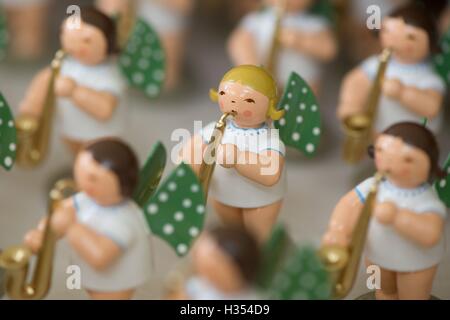 Angel figures featuring musical instruments and eleven white dots on green wings seen in the facilities of the family business Wendt & Kuehn in Gruenhainichen, Germany, 20 September 2016. The German company has manufactured handcrafted small-sized wooden artworks since 1915. Since 2014, figurines produced by the company have been on display in various cities such as St. Petersburg, Moscow and Shanghai as part of a world tour entitled 'Handmade in Germany.' The next stop will be Beijing, China, from 21 to 30 October 2016. Photo: Sebastian Kahnert/dpa Stock Photo