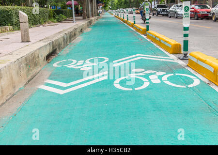 Bicycle lane with white bicycle sign Stock Photo