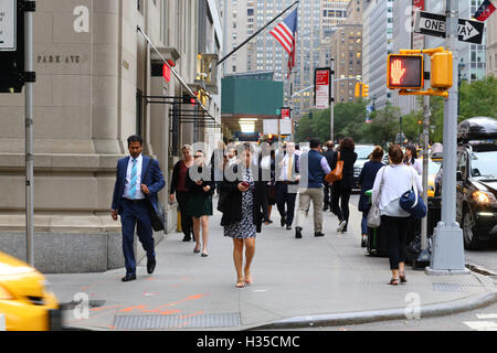 People, office workers, and tourists walking down Park Avenue in Manhattan, New York, NY. Stock Photo