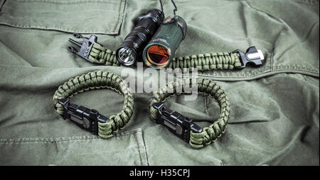 Military paracord bracelet, tactical torch and spy-glass Stock Photo