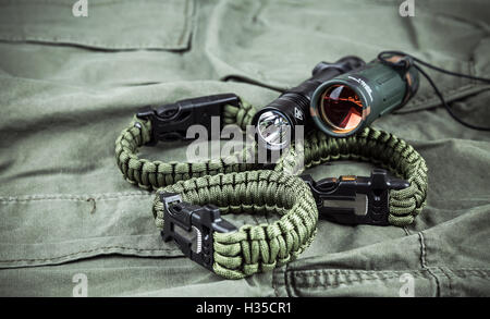 Military paracord bracelet, tactical torch and spy-glass Stock Photo