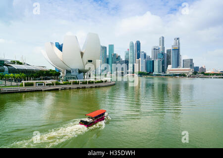 Singapore skyline, skyscrapers with the lotus flower shaped ArtScience Museum in the foreground by Marina Bay, Singapore Stock Photo