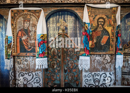 Old wooden painted church in Sarbi, Maramures, Romania Stock Photo