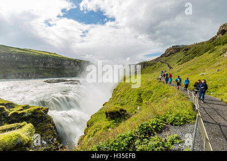Tourists visiting Gullfoss (Golden Falls), a waterfall located in the canyon of the Hvita River in southwest Iceland Stock Photo