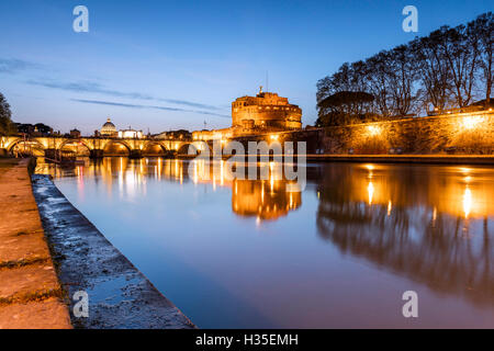 Dusk on the ancient palace of Castel Sant'Angelo with statues of angels on the bridge on Tiber RIver, UNESCO, Rome, Lazio, Italy Stock Photo