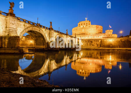 Dusk on the ancient palace of Castel Sant'Angelo with statues of angels on the bridge on Tiber RIver, UNESCO, Rome, Lazio, Italy Stock Photo