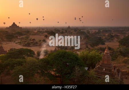 Hot air balloons at sunrise above Bagan (Pagan), Myanmar (Burma) Stock Photo