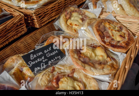 Bacon and cheese puff pastry slices for sale. Stock Photo