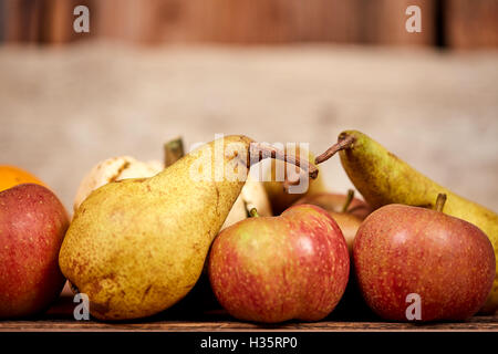 Apples and üears on a wooden table as rustical background Stock Photo