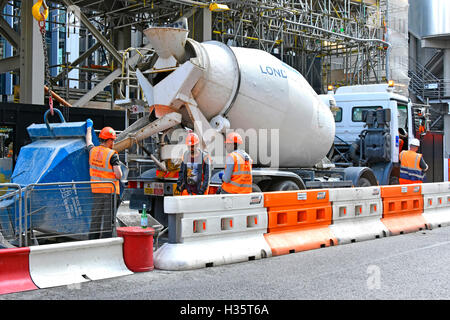 Temporary part road closure City of London to facilitate park & unload concrete delivery trucks construction building site new Scalpel skyscraper UK Stock Photo