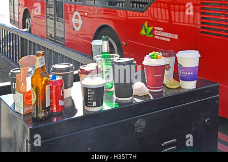 Used empty lunch break drink & coffee containers on top of roadside cabinet (not a rubbish bin) on London Bridge City of London at 3.00pm Stock Photo