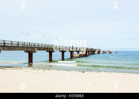 Tourists on the pier at the Baltic Sea beach of Goehren, Ruegen, Germany Stock Photo