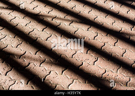 Abstract pattern of ligt on a stone tiled floor. Stock Photo