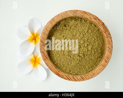 Henna powder in coconut bowl and tiare Stock Photo