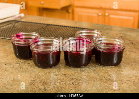 Jam ready to be sealed for storage. Stock Photo