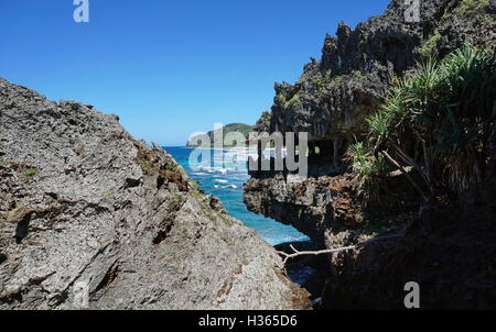 Eroded coastal cliff that looks like monster jaws on the shore of Rurutu island, Pacific ocean, Austral, French Polynesia Stock Photo