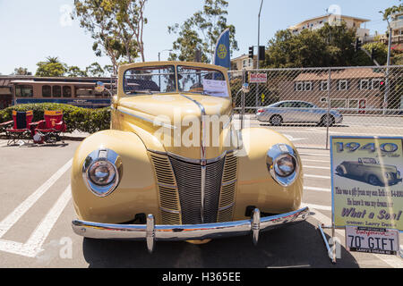 Laguna Beach, CA, USA - October 2, 2016: Yellow 1940 Ford Deluxe Convertible owned by Larry Davis and displayed at the Rotary Cl Stock Photo