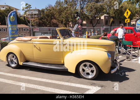 Laguna Beach, CA, USA - October 2, 2016: Yellow 1940 Ford Deluxe Convertible owned by Larry Davis and displayed at the Rotary Cl Stock Photo