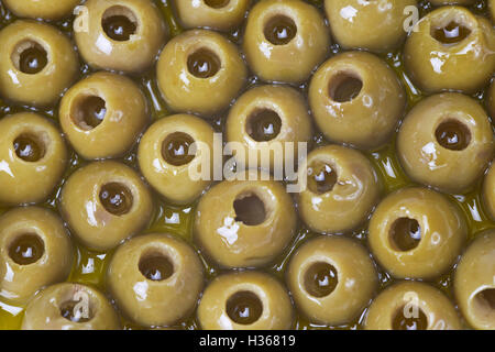 Texture of pitted olives covered in olive oil and ready to eat Stock Photo