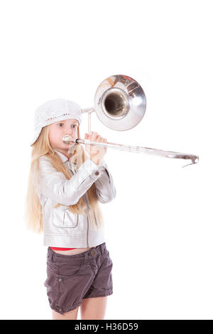 young girl with cap playing trombone Stock Photo